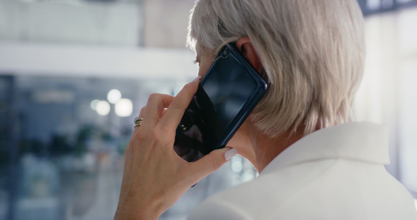 Woman talking on a telephone